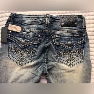Miss Me mid-rise boot cut jeans. SIZE: 28.